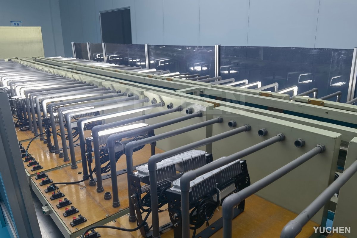 Floodlight batches on aging test racks in the factory